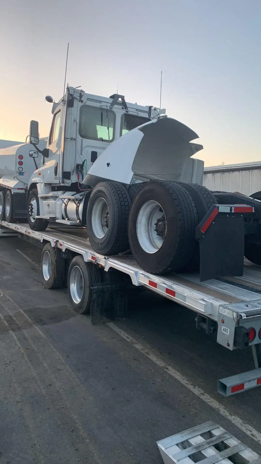 Manteca crew transporting a semi tractor on a Landoll trailer.