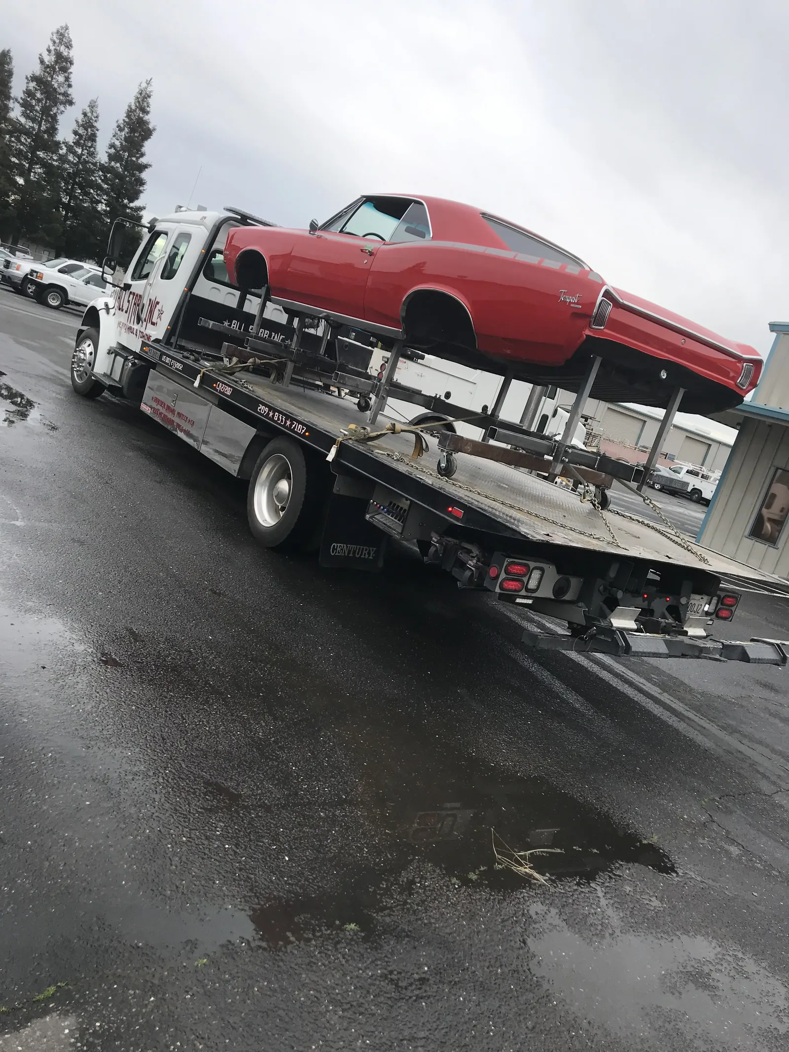 Passenger vehicle loaded onto an All Star transport carrier.