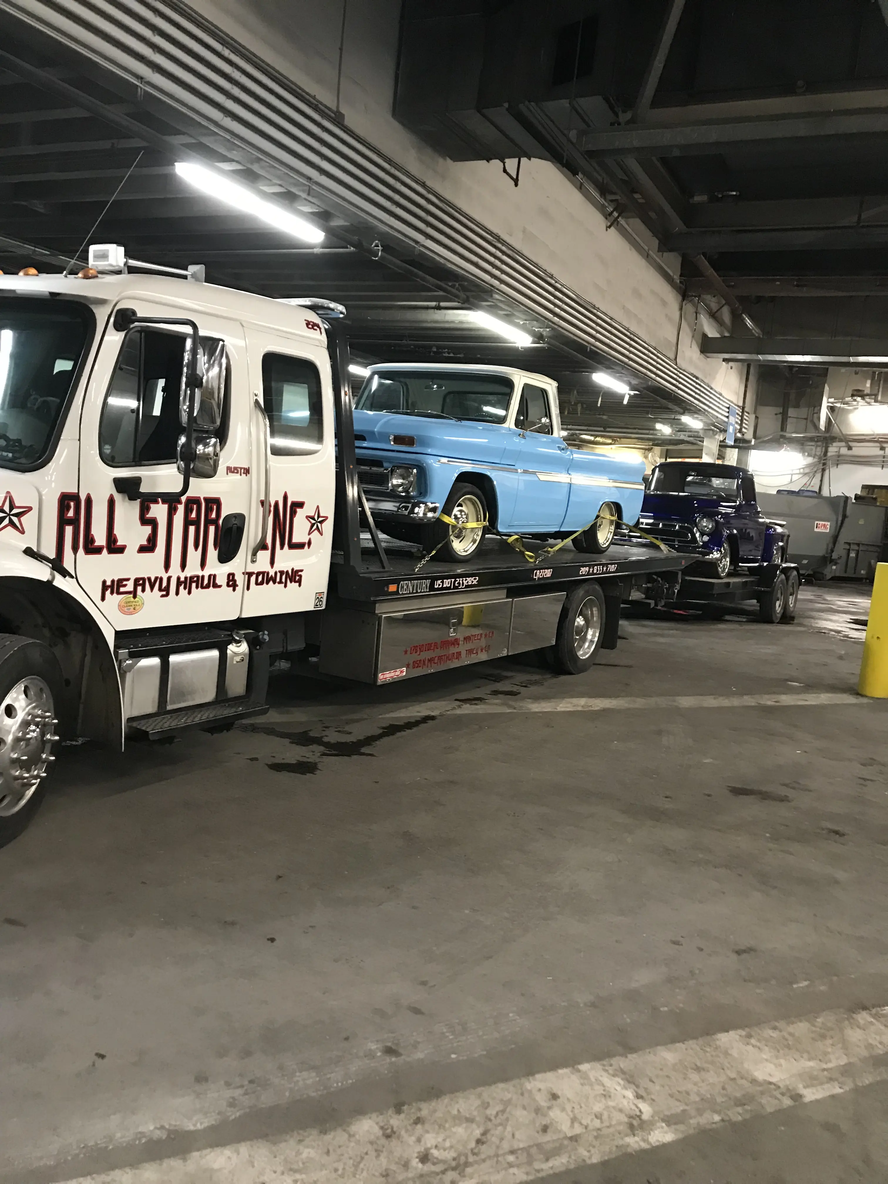 Classic car being transported on a flatbed by All Star Tracy.