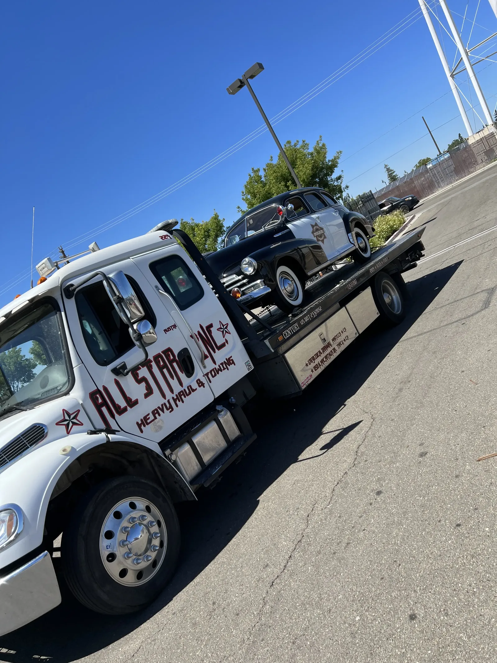 All Star transporting a classic car for a private collector.