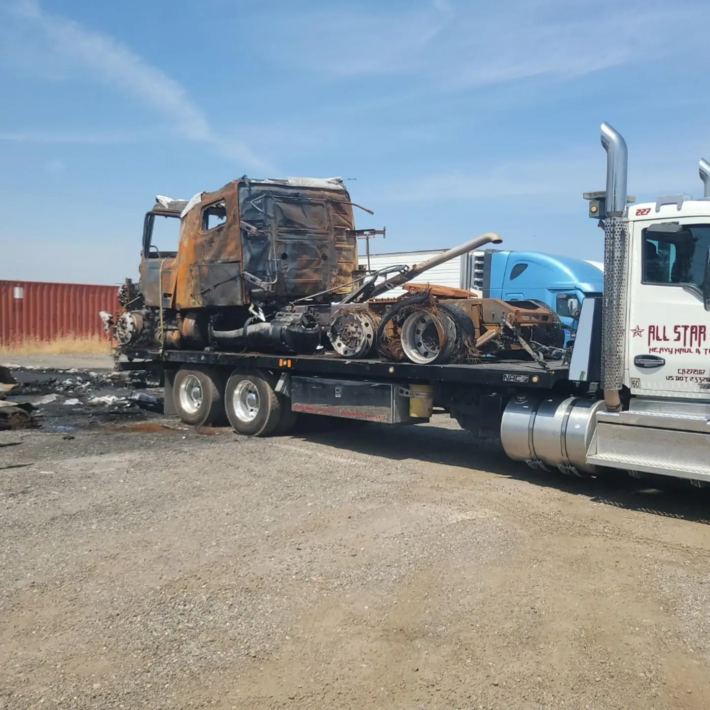 All Star crew running a recovery on a fire-damaged commercial truck.