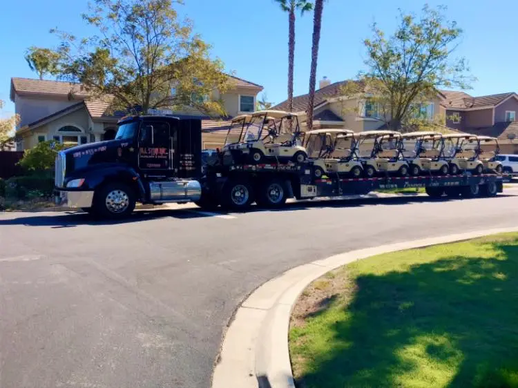 Golf cart secured on an All Star transport.